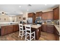 Stylish kitchen with granite countertops, stainless steel appliances, and ample cabinet space at 6763 W Wethersfield Rd, Peoria, AZ 85381