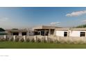 Contemporary home with a unique fence, lush green lawn and modern design at 7141 E Ironwood Dr, Paradise Valley, AZ 85253