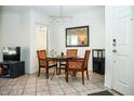 Inviting dining room with modern lighting, tile floors, and comfortable seating for four at 7575 E Indian Bend Rd # 1012, Scottsdale, AZ 85250