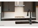 Kitchen island features a matte black faucet and sink at 1336 E Cherrywood Pl, Chandler, AZ 85249