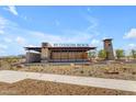 Inviting entrance to Blossom Rock community with stone accents and modern signage at 1380 W Ridge Rd, Apache Junction, AZ 85120