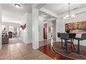 Bright open-concept entryway with decorative details leading to living spaces and kitchen at 17696 N 168Th Dr, Surprise, AZ 85374