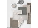 Assortment of interior design materials showing neutral palettes of paint, flooring, tile, and cabinet samples at 17809 W Elm St, Goodyear, AZ 85395