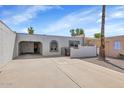 Charming single-story home with a private courtyard, desert landscaping and attached carport at 2119 N Recker Rd, Mesa, AZ 85215