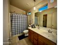 Bathroom featuring tile floors, a spacious vanity, and a shower-tub combination, offering comfort and functionality at 2150 E Bell Rd # 1113, Phoenix, AZ 85022