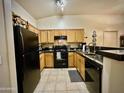 Traditional kitchen featuring wood cabinets, granite countertops, and modern appliances, ready for culinary adventures at 2150 E Bell Rd # 1113, Phoenix, AZ 85022