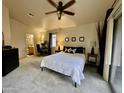 Spacious main bedroom with an ensuite bath, ceiling fan, and access to a patio for a serene retreat at 2150 E Bell Rd # 1113, Phoenix, AZ 85022