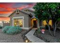 This single-story home has a charming front entryway and a low-maintenance yard and walkway with landscape lighting at 28802 N 45Th St, Cave Creek, AZ 85331