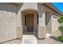 Inviting front entrance featuring a covered porch and decorative details at 301 S 225Th Ave, Buckeye, AZ 85326
