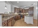 Spacious kitchen featuring granite countertops, stainless steel appliances, and an island at 301 S 225Th Ave, Buckeye, AZ 85326