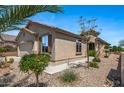 Well-maintained home showcasing desert landscaping, textured stucco, and privacy at 301 S 225Th Ave, Buckeye, AZ 85326