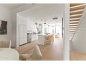 Open-concept kitchen with island seating and stainless steel appliances, seamlessly connects to other living spaces at 312 E Windsor Ave # 3, Phoenix, AZ 85004