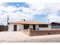 This is a single-story home with a side door and a driveway at 3128 N 40Th Ave, Phoenix, AZ 85019