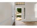 Bright foyer featuring tile flooring and a view of the front yard through an open front door at 332 N Cobblestone St, Gilbert, AZ 85234