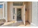 Bright foyer showcasing modern tile flooring, staircase, and an open doorway at 332 N Cobblestone St, Gilbert, AZ 85234