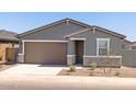 Inviting single-story home with a two-car garage and well-maintained yard at 3582 E Audrey Dr, San Tan Valley, AZ 85143