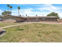 Ranch style house with a brick facade and a walkway through the front yard at 530 E Draper St, Mesa, AZ 85203