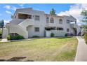Condominium with manicured lawn and a well-maintained, two-story facade at 850 S River Dr # 1068, Tempe, AZ 85281