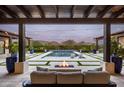 Inviting outdoor space with fire pit, pool, and comfortable seating at 8821 E Havasupai Dr, Scottsdale, AZ 85255