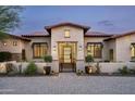 Charming front entrance featuring a decorative gate and manicured landscaping at 8821 E Havasupai Dr, Scottsdale, AZ 85255