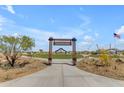 Welcoming park entrance with a stone walkway, benches, and lush greenery at 886 W Peralta Pass, Apache Junction, AZ 85120