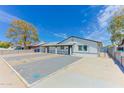 Single-story home featuring a carport, spacious driveway, and drought-resistant landscaping at 1510 W 7Th Dr, Mesa, AZ 85202