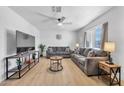 Bright living room with wood floors, stylish furnishings, and ample natural light at 1510 W 7Th Dr, Mesa, AZ 85202