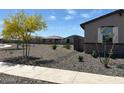 Charming single-story home featuring neutral paint, desert landscaping, and an attached two-car garage at 16071 W Remuda Dr, Surprise, AZ 85387