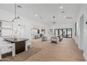 Expansive open-concept living room with modern furnishings and abundant natural light at 2546 E Roma Ave, Phoenix, AZ 85016