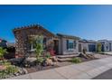 Charming single-story home boasts stone accents and manicured landscaping for an appealing curb appeal at 26689 W Ponderosa Ln, Buckeye, AZ 85396