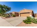 Charming single-story home featuring a tile roof, desert landscaping, and a spacious driveway at 29193 N Mountain View Rd, San Tan Valley, AZ 85143