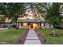 Charming single-story home with mature trees, inviting walkway and desert-friendly landscaping at 4020 N 34Th St, Phoenix, AZ 85018