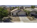 Aerial view of a single-story home with a two-car garage and desert landscaping at 40845 W Thornberry Ln, Maricopa, AZ 85138