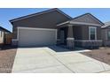 Charming single-story home showcasing a well-maintained front yard, concrete driveway, and attached two-car garage at 4213 E Kolin Ln, San Tan Valley, AZ 85143
