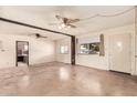 Spacious living room with ceiling fans, natural light, and a neutral color palette at 4343 E Union Hills Dr, Phoenix, AZ 85050