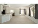 Bright living room with open kitchen and tile floors at 4349 E Windsor Ct, Gilbert, AZ 85296