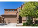 Charming two-story home with desert landscaping featuring a two-car garage at 6746 W Wethersfield Rd, Peoria, AZ 85381