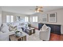 Inviting living room showcasing hardwood floors, shuttered windows, and stylish furniture, enhancing comfort at 7633 W Kristal Way, Glendale, AZ 85308