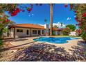 Backyard with large pool and landscaped yard with privacy at 9629 N 83Rd Way, Scottsdale, AZ 85258