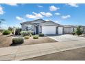 Beautiful single-story home with a three-car garage and desert landscaping at 35733 W Santa Monica Ave, Maricopa, AZ 85138