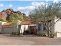Charming home with a beautiful terra cotta roof, desert landscaping, and mountain views at 5804 N Echo Canyon Ln, Phoenix, AZ 85018