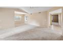 Open-concept living room offering lots of natural light and neutral carpet flooring at 9736 N 95Th St # 225, Scottsdale, AZ 85258