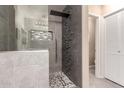 Modern walk-in shower with sleek tile and contemporary fixtures at 18911 N Miller Way, Maricopa, AZ 85139