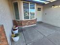 Inviting front porch with stylish brick accents and charming curb appeal at 3722 E Glade Ave, Mesa, AZ 85206