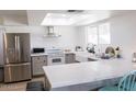 Bright kitchen featuring stainless steel appliances, white countertops, and a large undermount sink at 3722 E Glade Ave, Mesa, AZ 85206