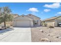 Charming single-Gathering house with a two-car garage and desert landscaping at 43849 W Cowpath Rd, Maricopa, AZ 85138