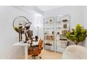 Bright office area featuring modern desk, shelving, and comfortable seating at 7131 E Rancho Vista Dr # 1008, Scottsdale, AZ 85251