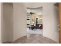 Spacious foyer leading into a well-lit living area with comfortable seating and a view to the outdoor areas at 7445 E Eagle Crest Dr # 1015, Mesa, AZ 85207