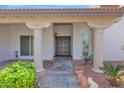 Inviting front entrance with stone walkway leading to a decorative front door and column features at 8337 E Shetland Trl, Scottsdale, AZ 85258