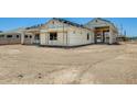 New home featuring a durable frame and large garage, awaiting final touches at 14723 N 73Rd Dr, Peoria, AZ 85381